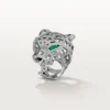Anello Panthere De Cartier – Oro bianco, smeraldi, onice, diamanti – Cartier