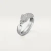 Anello Panthere De Cartier – Oro bianco, smeraldi, onice, diamanti – Cartier
