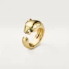 Anello Panthere De Cartier – Oro giallo, onice, granato tsavorite – Cartier