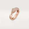 Anello Panthere De Cartier – Oro rosa, onice, smeraldi, diamanti – Cartier