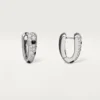 Orecchini a cerchio piccoli Panthere Diamond, oro bianco | Cartier Us