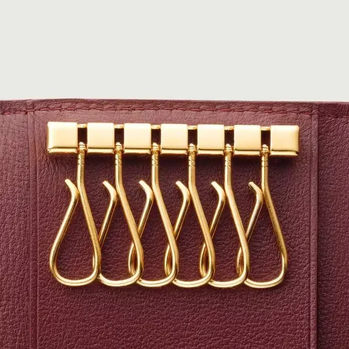 Portachiavi a 6 anelli, Must De Cartier – Pelle di vitello bordeaux, finitura dorata – Cartier