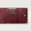 Portachiavi a 6 anelli, Must de Cartier – Pelle di vitello nera, finitura in acciaio inossidabile – Cartier