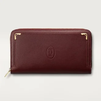 Portafoglio internazionale con cerniera, Must De Cartier – Pelle di vitello bordeaux, finitura dorata – Cartier